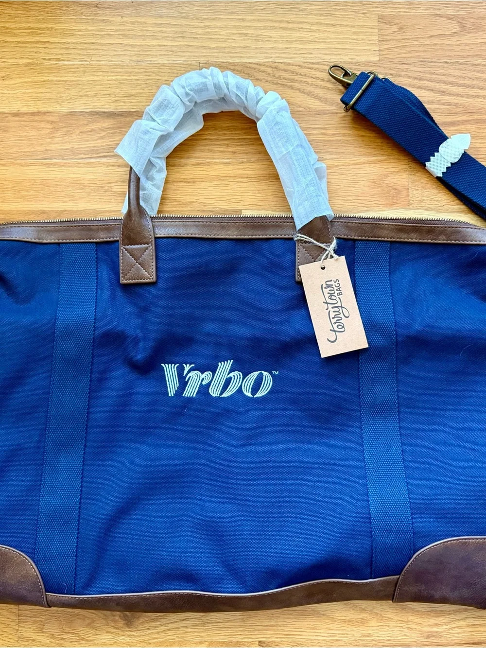 n Navy Duffel with Brown Trim in and White VRBO Logo